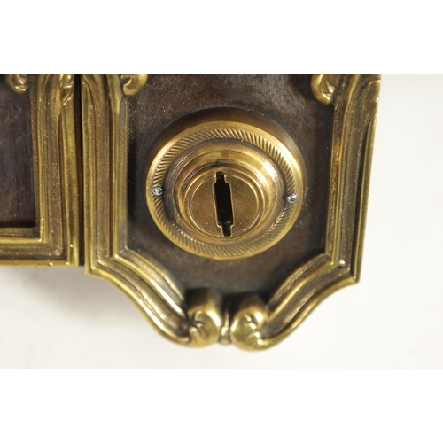 435 - A 19TH CENTURY FRENCH STEEL AND CAST BRASS MOUNTED DOOR LOCK of elaborate leaf cast Rococo design. (... 