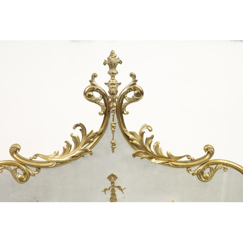 437 - A LATE 19TH CENTURY CAST BRASS FIRE SCREEN in the French Rococo style with meshwork front and centre... 