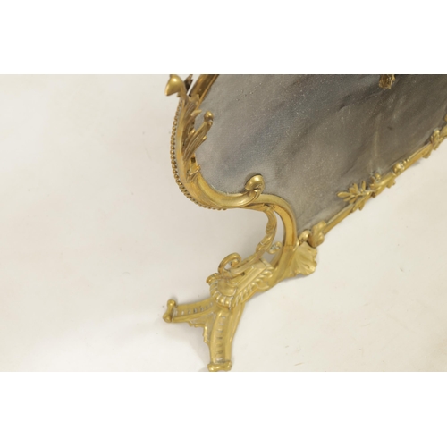 437 - A LATE 19TH CENTURY CAST BRASS FIRE SCREEN in the French Rococo style with meshwork front and centre... 