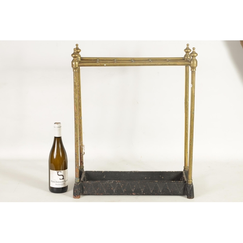 440 - A LATE 19TH CENTURY BRASS AND CAST IRON STICK STAND fitted a 12 sectioned top on four brass stems wi... 