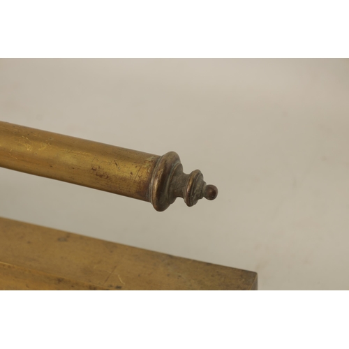 441 - A 19TH CENTURY BRASS FENDER with baluster uprights and rail top, raised on a moulded plinth base (14... 