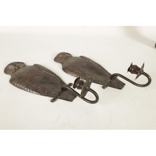 442 - A PAIR OF ARTS AND CRAFTS COPPER WALL LIGHTS FORMED AS OWLS finely detailed with scrolled leaf mould... 