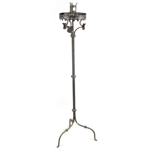 444 - A 17TH CENTURY CAST IRON STANDING PRICKET STICK with gothic style frieze above a knopped stem and tr... 