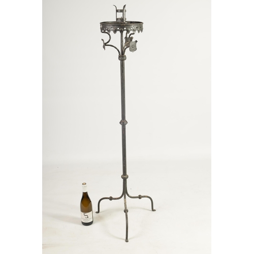 444 - A 17TH CENTURY CAST IRON STANDING PRICKET STICK with gothic style frieze above a knopped stem and tr... 