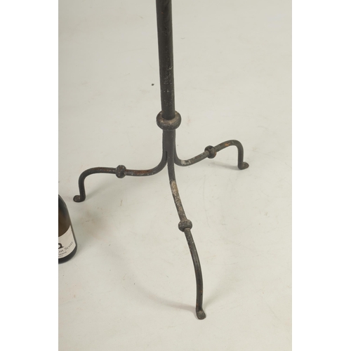 444 - A 17TH CENTURY CAST IRON STANDING PRICKET STICK with gothic style frieze above a knopped stem and tr... 