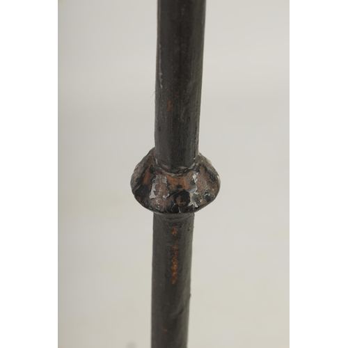 444 - A 17TH CENTURY CAST IRON STANDING PRICKET STICK with gothic style frieze above a knopped stem and tr... 