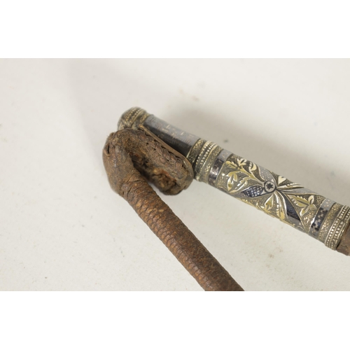 450 - AN EARLY 19TH CENTURY CAUCASIAN SILVER NIELLO AND LEATHER-BOUND FOLDING RIDING CROP the mounts with ... 