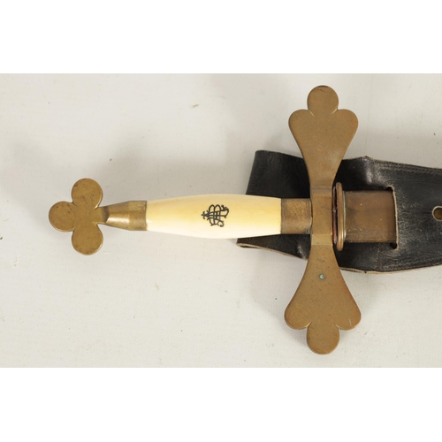 454 - AN EARLY 20TH CENTURY MASONIC CEREMONIAL IVORY HANDLED SWORD fitted a brass crossguard and pommel wi... 