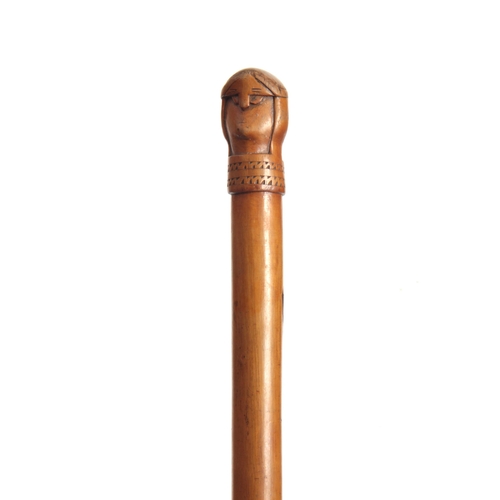 455 - AN EARLY 20TH CENTURY SCANDINAVIAN HARDWOOD WALKING STICK carved with a two-faced figural handle - p... 