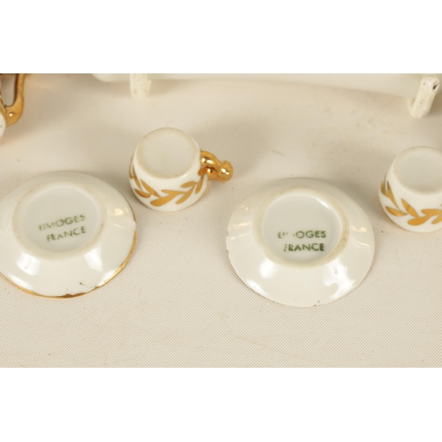 47 - AN EARLY 20TH CENTURY MINIATURE LIMOGES PORCELAIN FRENCH NAPOLEON TEA SERVICE comprising coffee can,... 