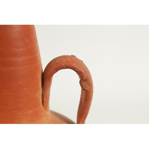 50 - A ROMAN TWO HANDLED TERRACOTTA VASE of shouldered form with tapering neck (20cm high)