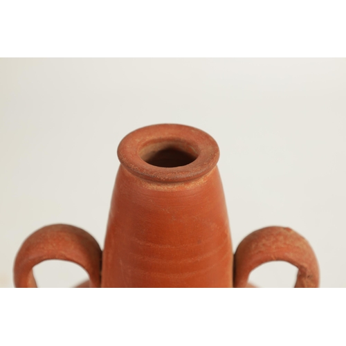 50 - A ROMAN TWO HANDLED TERRACOTTA VASE of shouldered form with tapering neck (20cm high)