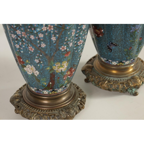 51 - A GOOD PAIR OF 19TH CENTURY JAPANESE CLOISONNÉ ORMOLU MOUNTED LAMP BASES brightly decorated with flo... 