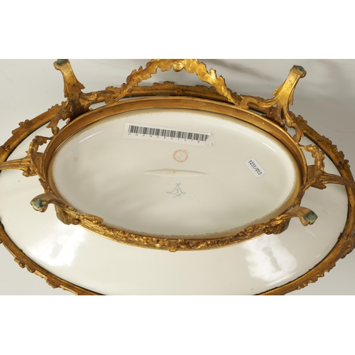 55 - A LATE 19TH CENTURY SERVES STYLE OVAL ORMOLU MOUNTED CENTREPIECE with a painted classical figure sce... 