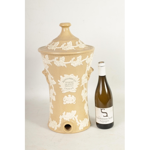 56 - A 19TH CENTURY EARTHENWARE F. LIPSCOMBE & CO. LONDON WATER FILTER with relief work grape vine decora... 