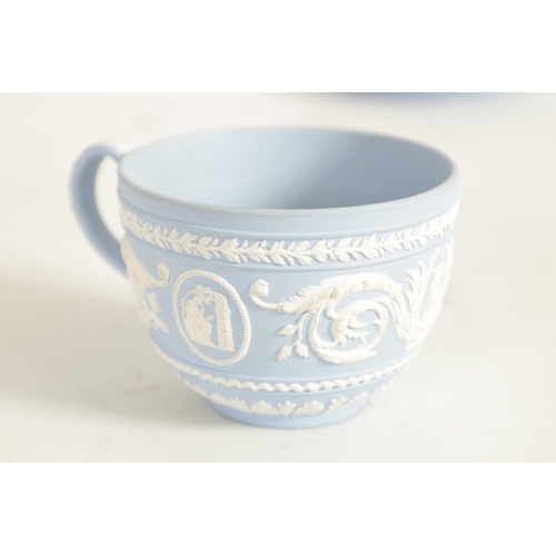 58 - A LATE 18TH CENTURY WEDGWOOD JASPERWARE CUP AND SAUCER decorated with classical figures and scrollin... 