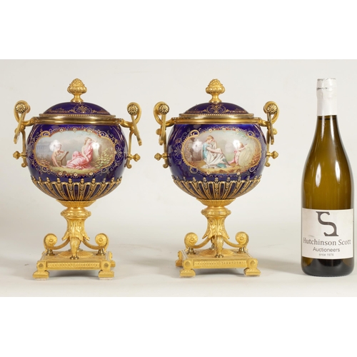 61 - A FINE PAIR OF 19TH CENTURY ORMOLU AND SEVRES PORCELAIN TWO HANDLED VASE AND COVERS the gilt and jew... 