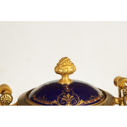 61 - A FINE PAIR OF 19TH CENTURY ORMOLU AND SEVRES PORCELAIN TWO HANDLED VASE AND COVERS the gilt and jew... 