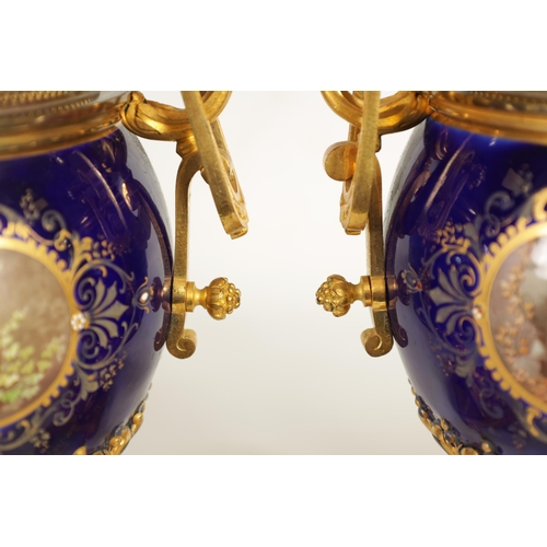 61 - A FINE PAIR OF 19TH CENTURY ORMOLU AND SEVRES PORCELAIN TWO HANDLED VASE AND COVERS the gilt and jew... 