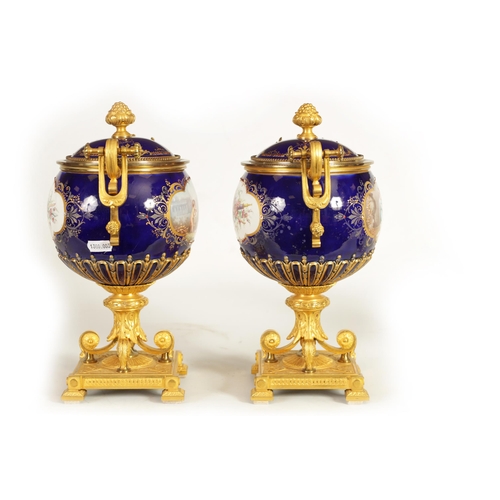 61 - A FINE PAIR OF 19TH CENTURY ORMOLU AND SEVRES PORCELAIN TWO HANDLED VASE AND COVERS the gilt and jew... 