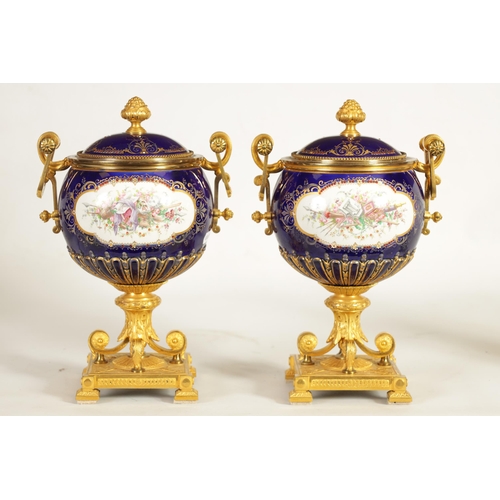 61 - A FINE PAIR OF 19TH CENTURY ORMOLU AND SEVRES PORCELAIN TWO HANDLED VASE AND COVERS the gilt and jew... 