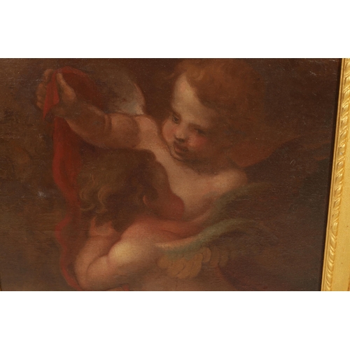 611 - A 17TH CENTURY STYLE FLEMISH SCHOOL OIL ON CANVAS DEPICTING TWO WINGED CHERUBS mounted in a gilt mou... 