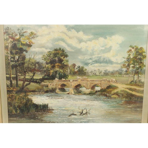 629 - A 19TH CENTURY OIL ON CANVAS. Country house landscape with bridge, inscription on reverse 