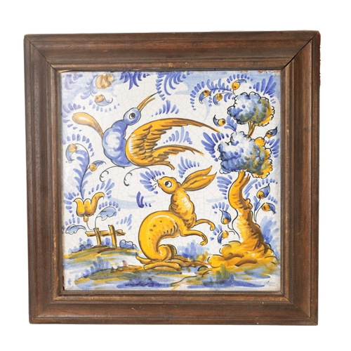 64 - A 19TH CENTURY PORTUGUESE CERAMIC TILE polychrome coloured depicting a rabbit and bird in a landscap... 