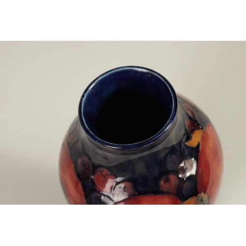 70 - A WILLIAM MOORCROFT POMEGRANATE PATTERN MOORCROFT VASE Circa 1930's of inverted baluster form tube l... 