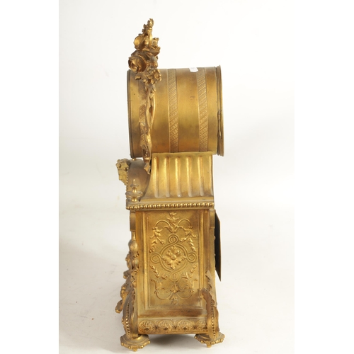 709 - A 19TH CENTURY FRENCH ORMOLU LARGE MANTEL CLOCK the ornate case with leaf and flower head crested dr... 