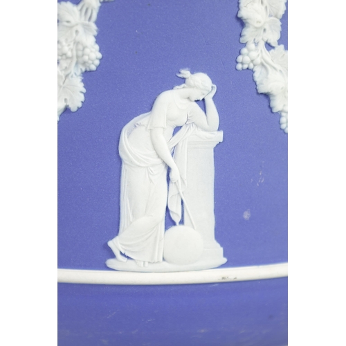 88 - A LARGE WEDGWOOD JASPERWARE JARDINIERE with classical figures and lions masks united by grape vine g... 