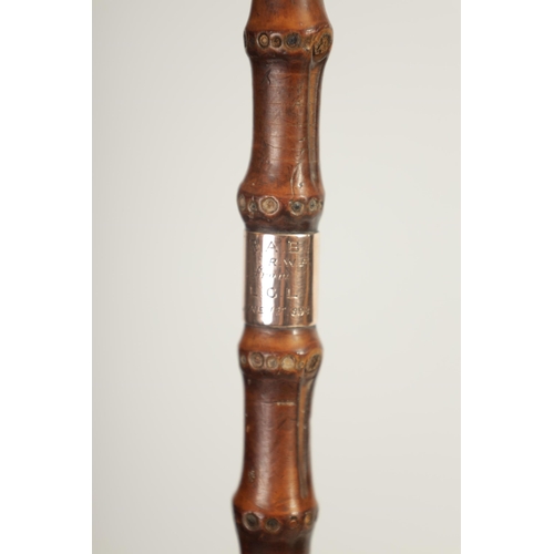 462 - A LATE 19TH CENTURY 9CT GOLD TIPPED BAMBOO WALKING STICK BY BRIGG with hooped handle and rose gold t... 