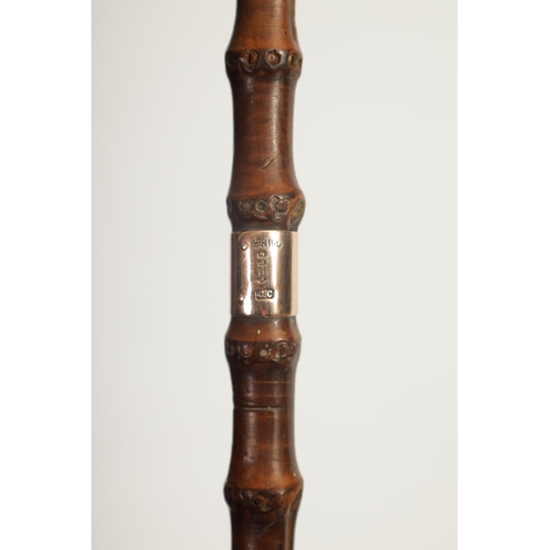 462 - A LATE 19TH CENTURY 9CT GOLD TIPPED BAMBOO WALKING STICK BY BRIGG with hooped handle and rose gold t... 