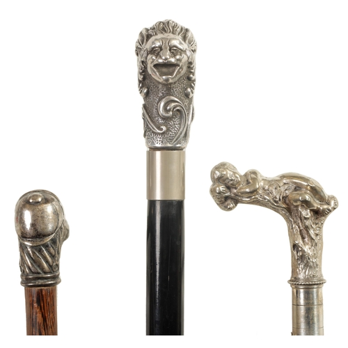 464 - THREE LATE 19TH CENTURY SILVER METAL MOUNTED WALKING CANES depicting a horse stirrup and hat handle ... 