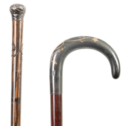 467 - TWO EARLY 20TH CENTURY FRENCH WALKING CANES one with Art Nouveau gold inlaid handle and tapering mah... 