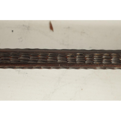 477 - A 19TH CENTURY CARVED HARDWOOD WALKING STICK with simulated carved bark and knots to the shaft with ... 