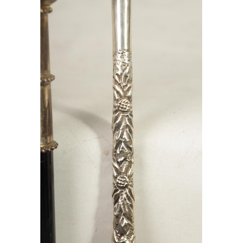 482 - TWO LATE 19TH CENTURY EBONISED WALKING CANES WITH SILVER PLATED MOUNTS one modelled as 'Mr. Punch' t... 