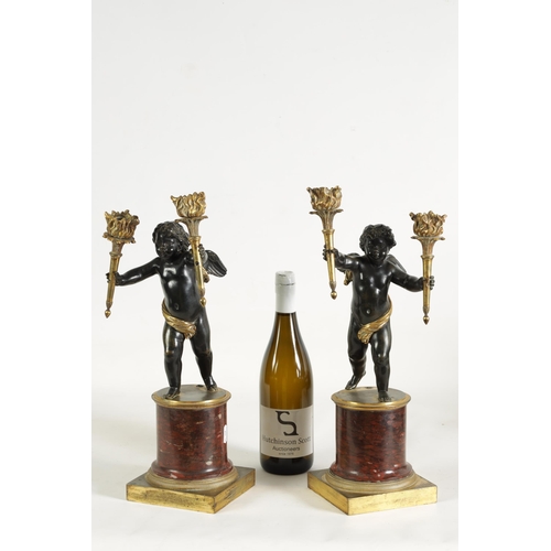 490 - A PAIR OF EARLY 19TH CENTURY FRENCH GILT BRONZE AND ROUGE MARBLE TWO BRANCH CHERUB CANDELABRA modell... 