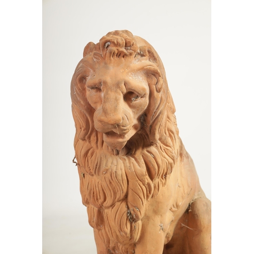 491 - A PAIR OF 19TH CENTURY TERRACOTTA LIONS seated on rectangular bases (74cm high 72cm deep )