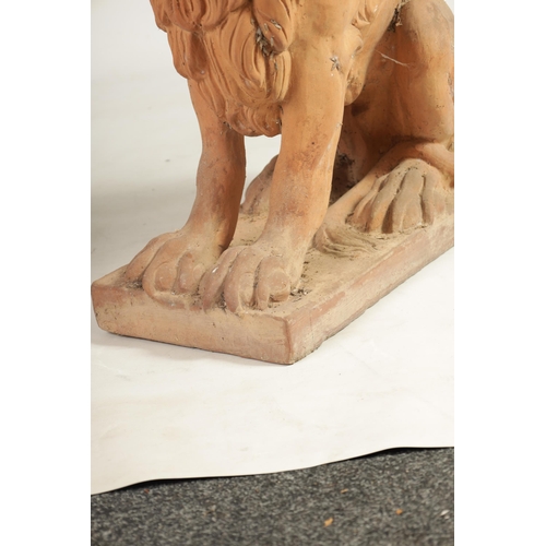 491 - A PAIR OF 19TH CENTURY TERRACOTTA LIONS seated on rectangular bases (74cm high 72cm deep )