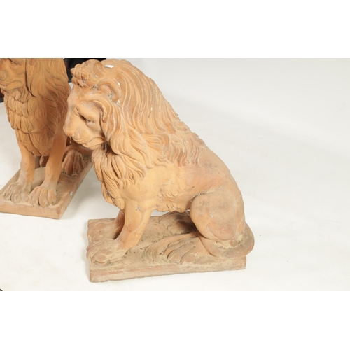 491 - A PAIR OF 19TH CENTURY TERRACOTTA LIONS seated on rectangular bases (74cm high 72cm deep )