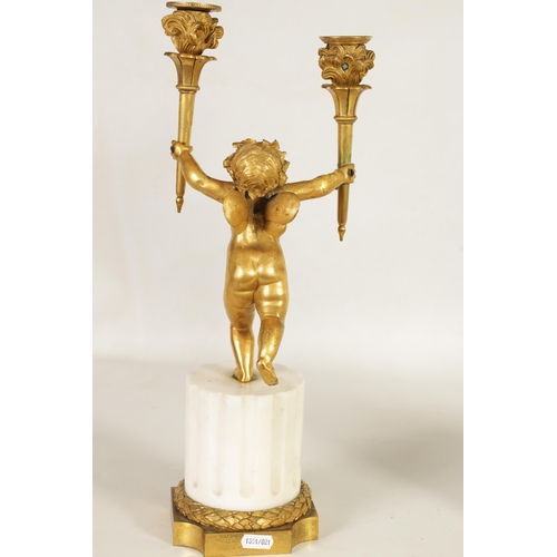 492 - A PAIR OF 18TH/19TH CENTURY BRONZE AND ORMOLU CANDELABRA formed as standing cherubs holding torches;... 