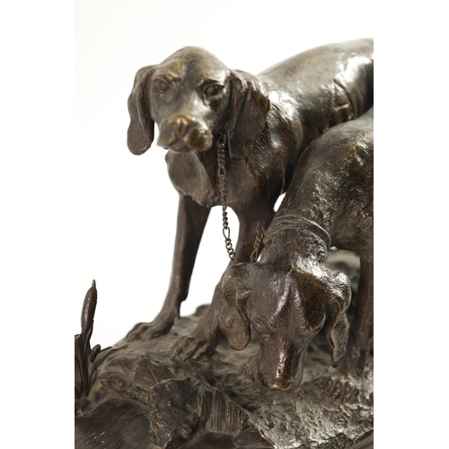 494 - CHRISTOPHER FRATIN (1801 - 1864). A 19TH CENTURY BRONZE DOG GROUP depicting two hounds mounted on a ... 