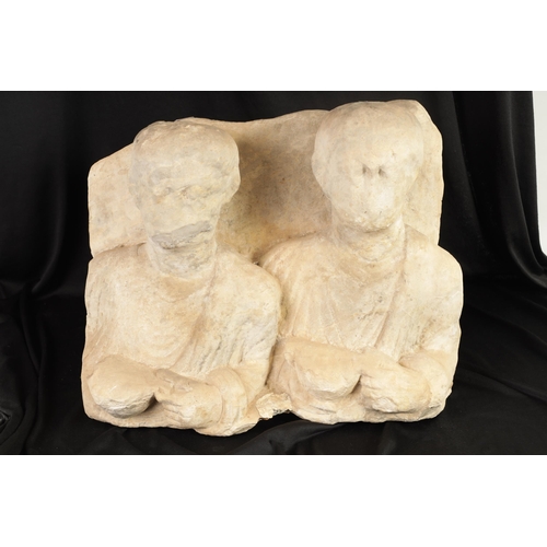 504 - AN EARLY ETRUSCAN ITALIAN POTTERY SCULPTURE depicting two half-length figures. (43cm wide 38cm high ... 