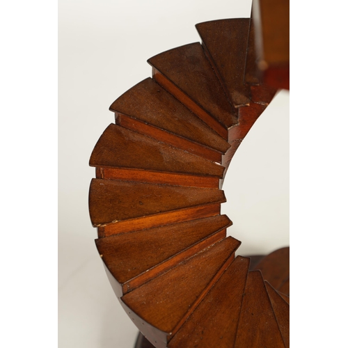 507 - A 20TH CENTURY MAHOGANY FRENCH MODEL OF A SPIRAL STAIRCASE mounted on circular moulded edge plinth b... 