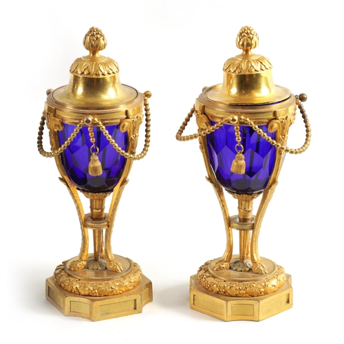 510 - A FINE PAIR OF REGENCY FRENCH ORMOLU AND BLUE GLASS REVERSIBLE CASOLETTES with changeable urn and ca... 