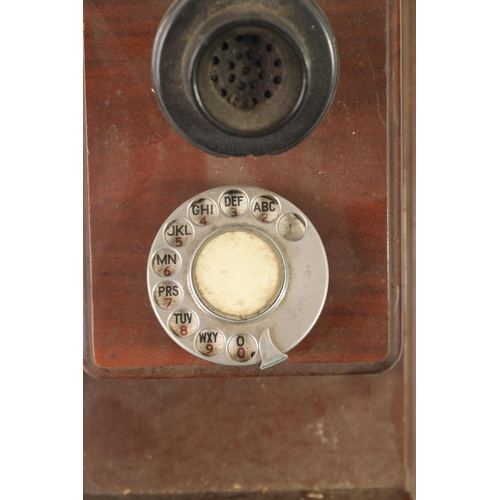 511 - TWO EARLY 20TH CENTURY TELEPHONES one wall mounted in a mahogany case, the other stick phone with Ba... 