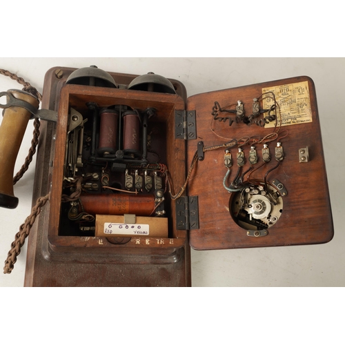 511 - TWO EARLY 20TH CENTURY TELEPHONES one wall mounted in a mahogany case, the other stick phone with Ba... 