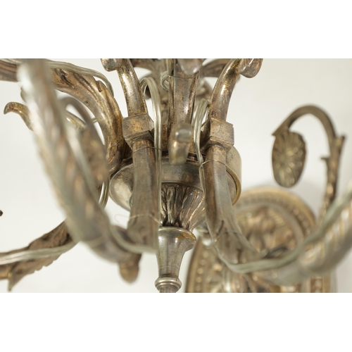 518 - A PAIR OF LATE 19TH CENTURY SILVERED BRONZE WALL SCONCES with six leaf cast branches and oval back p... 