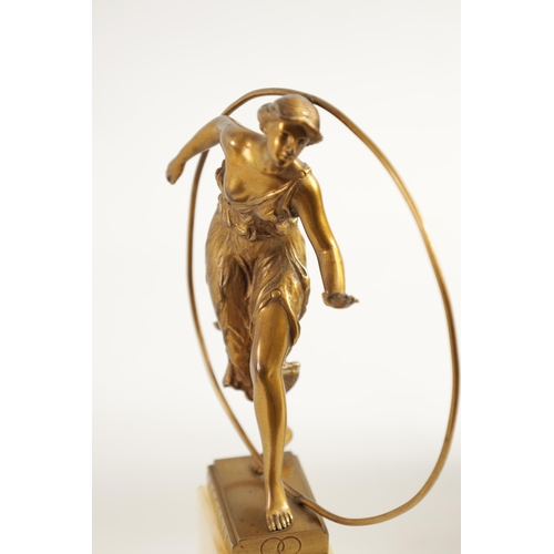 520 - AN ART DECO GILT BRONZE FIGURE GROUP depicitng a 'Hoop Girl' mounted on a stepped onyx base. (18cm h... 